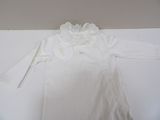 a white dress with a white lace collar on it
