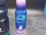 a bottle of deodorant and a bottle of deodorant on a counter