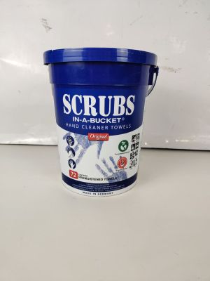a bucket of scrubs sitting on top of a counter