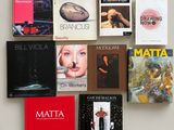 a lot of books on the wall that are on display