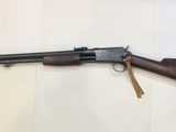 a rifle that is on display in a museum