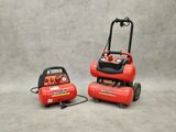 a couple of air compressors sitting on top of each other