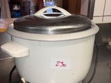a white crock pot with a lid on a kitchen counter