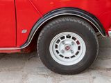 a red car parked on the side of the road