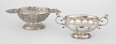 pair of silver plated bowls with handles and handles
