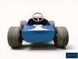 a blue toy car with a steering wheel on a white background