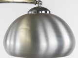 an image of a metal lamp on a wall with a white background