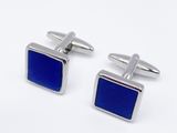 two pairs of cufflinks with blue enamel on them