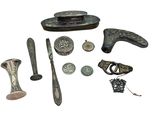 a lot of silver items that are on a white surface