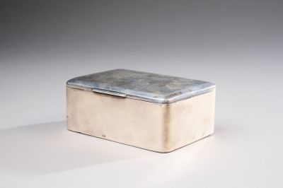 a small silver box sitting on a white surface