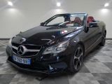 a picture of a black mercedes convertible parked in a showroom