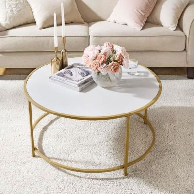 a coffee table with flowers on it in a living room