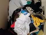 a cardboard box filled with clothes and other items