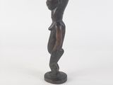 an image of a statue of a woman standing on a pedestal