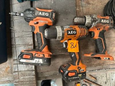 two electric tools that are sitting on a wooden table