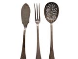 three forks and a spoon on a white background