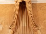 a bed with a canopy in the middle of a room