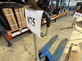 an image of a warehouse with pallets and a sign
