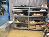 a room with a lot of items on the shelves