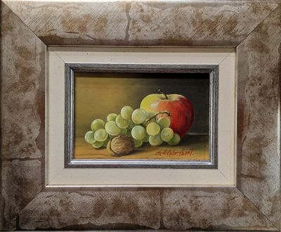 painting of a still life of grapes and an apple in a silver frame