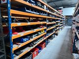 many shelves in the warehouse with many different types of tools