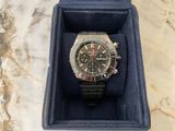 a watch in a blue box on a marble surface