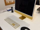 a computer on a desk with a keyboard and mouse