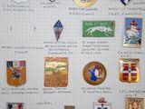 many different types of badges displayed on a piece of paper