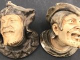 pair of antique carved wood figurines of two men with hats and beards