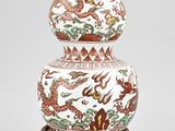 an image of a white vase with a dragon design on it