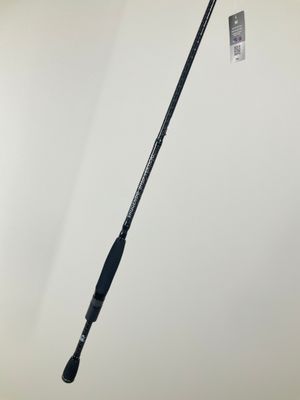 a close up of a fishing rod on a white surface