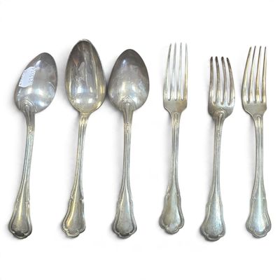 five spoons and a fork on a white surface