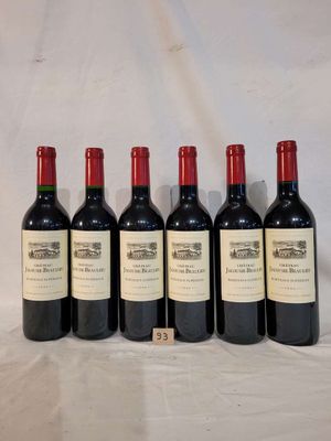 six bottles of wine are lined up on a table