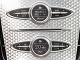 a close up of a car dashboard with a clock on it