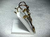 a pair of scissors sitting on top of a white piece of paper