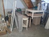 a room with a table, chair, and other items in it