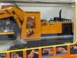 a toy construction vehicle in the box on the table