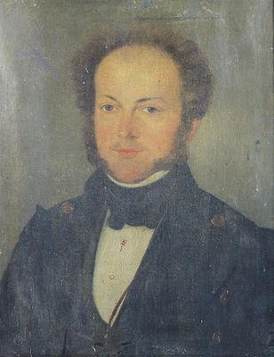 portrait d'un homme en manteau bleu et nœud papillon