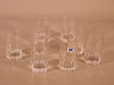 six glasses sitting on a table with a number on them