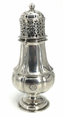 an antique silver salt shaker with a lid on a white background