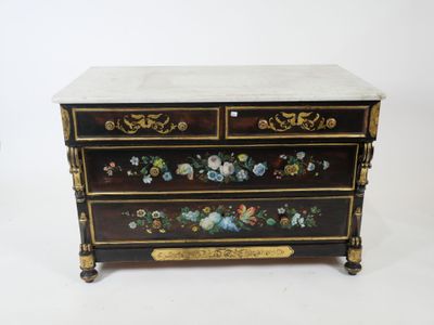 a black and gold chest of drawers with flowers painted on it