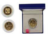 an image of a gold coin in a blue box with a pink ribbon