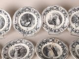 six black and white plates with pictures of people on them