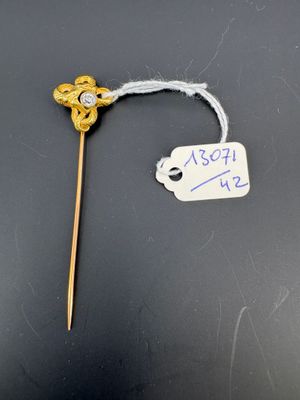 un petit bâtonnet muni d'une étiquette sur laquelle est représentée une fleur