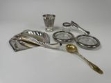 a lot of silver items that are on the table