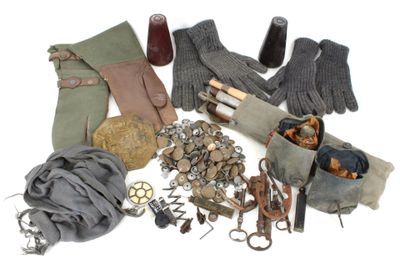 several pairs of gloves, gloves, and other items on a white surface