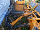 an image of a tractor that is parked in the grass