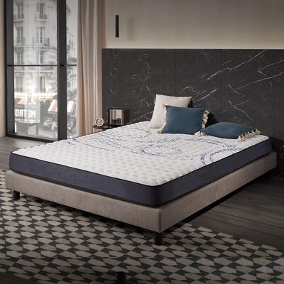 an image of a bedroom with a bed and a window