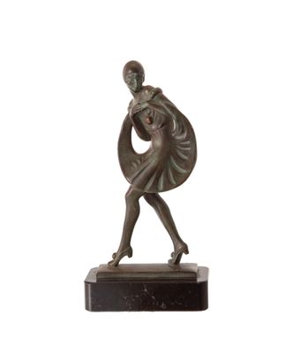 bronze statue of a woman carrying a bag on a marble base