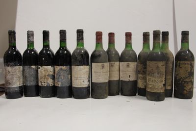 several bottles of wine are lined up in a row on a table